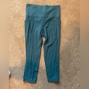 Athleta Teal salutation stash pocket High-Rise capri